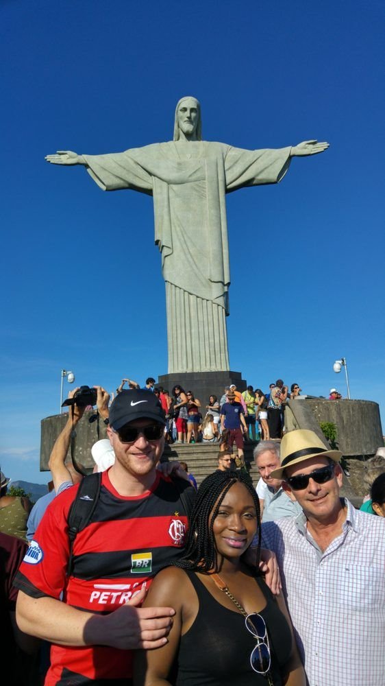 Travelers with Christ the Redeemer on a clear morning